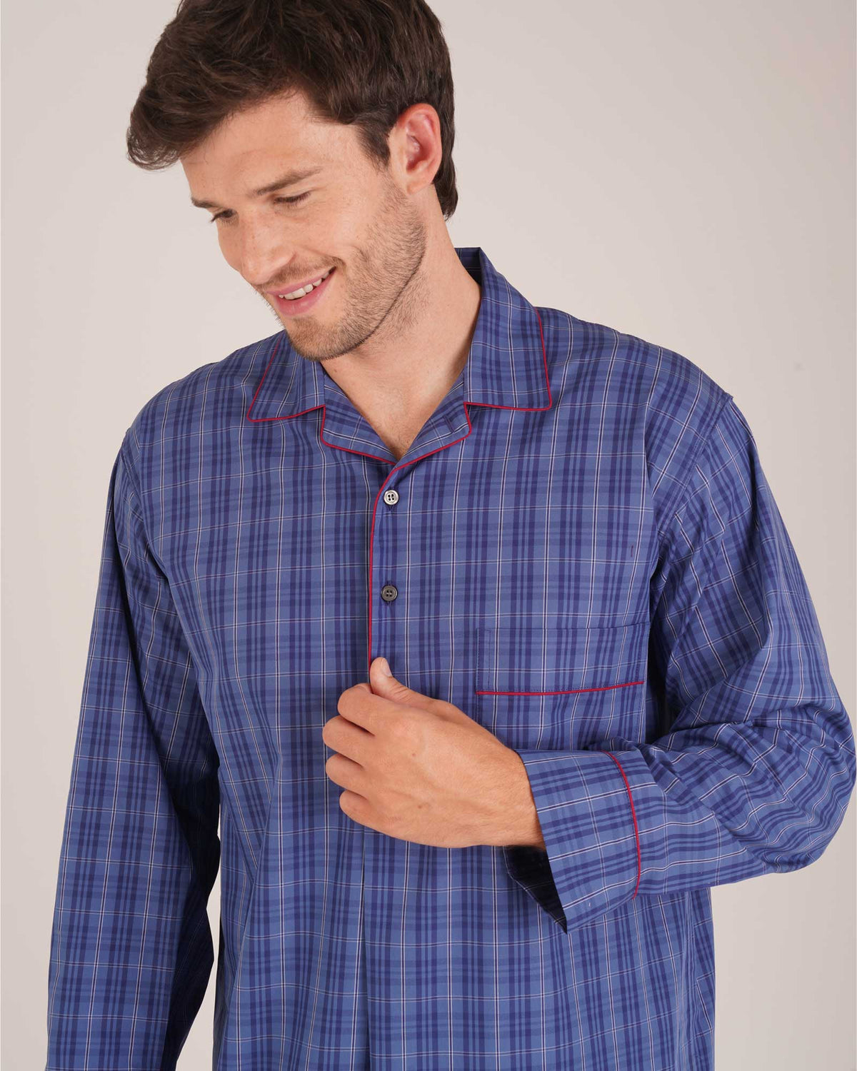Bonsoir of London Men’s Edward Blue Plaid Classic Cotton Nightshirt, featuring a blue plaid check design, four-button placket, shirt-tail hem and generously cut fit, close up shot on a model.
