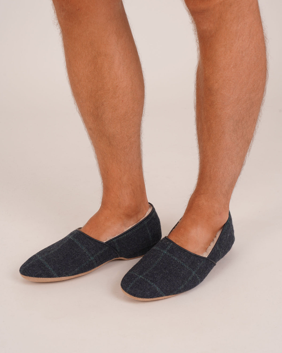 Bonsoir of London Men’s Anthony Sheepskin Slippers in Thomas Check, featuring Thomas Check wool uppers, signature sheepskin lining, suede sole, product shot on model.