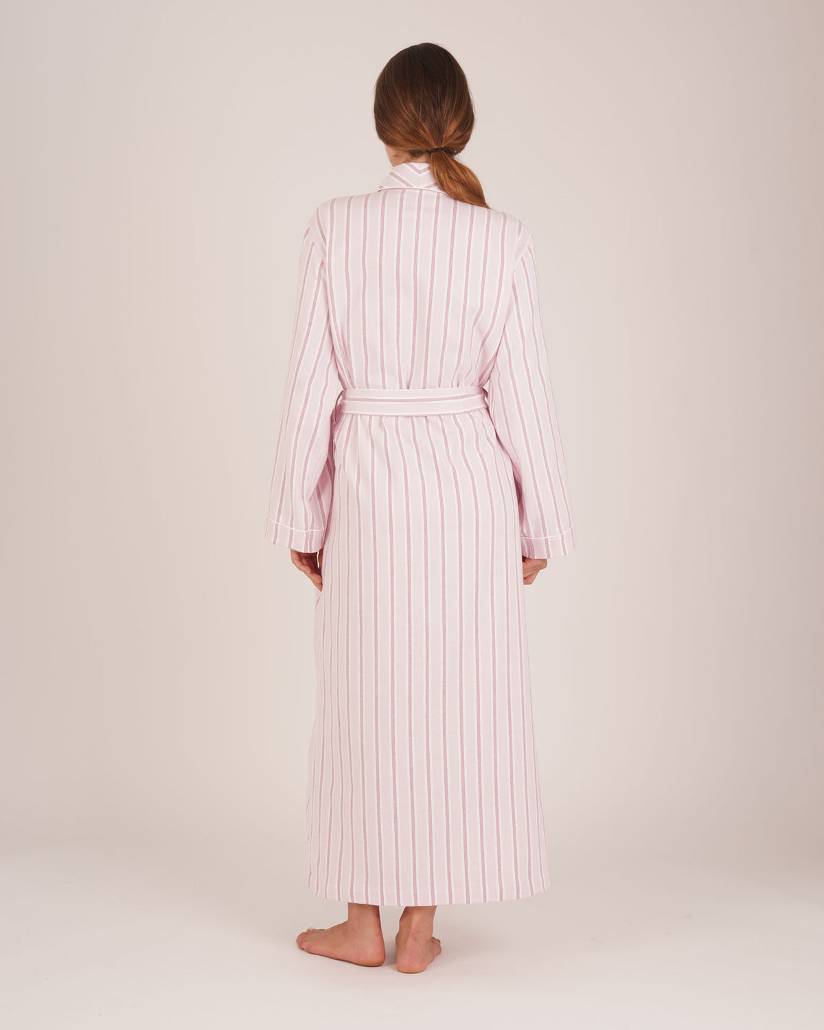 Bonsoir of London women’s brushed cotton dressing gown in Freya Pink Stripe, pink striped design, shot on model from back.