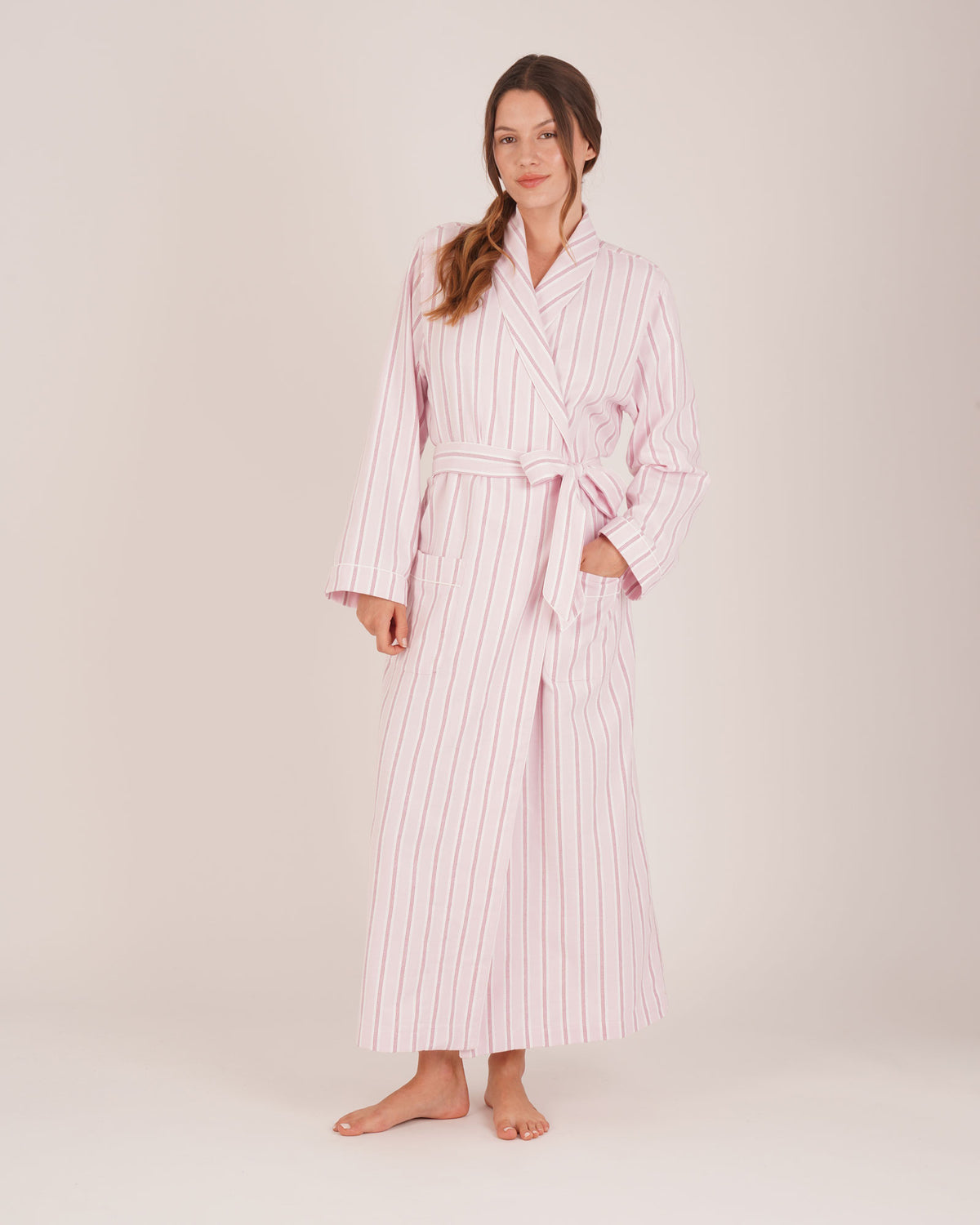 Bonsoir of London women’s brushed cotton dressing gown in Freya Pink Stripe, pink striped design, shot on model.