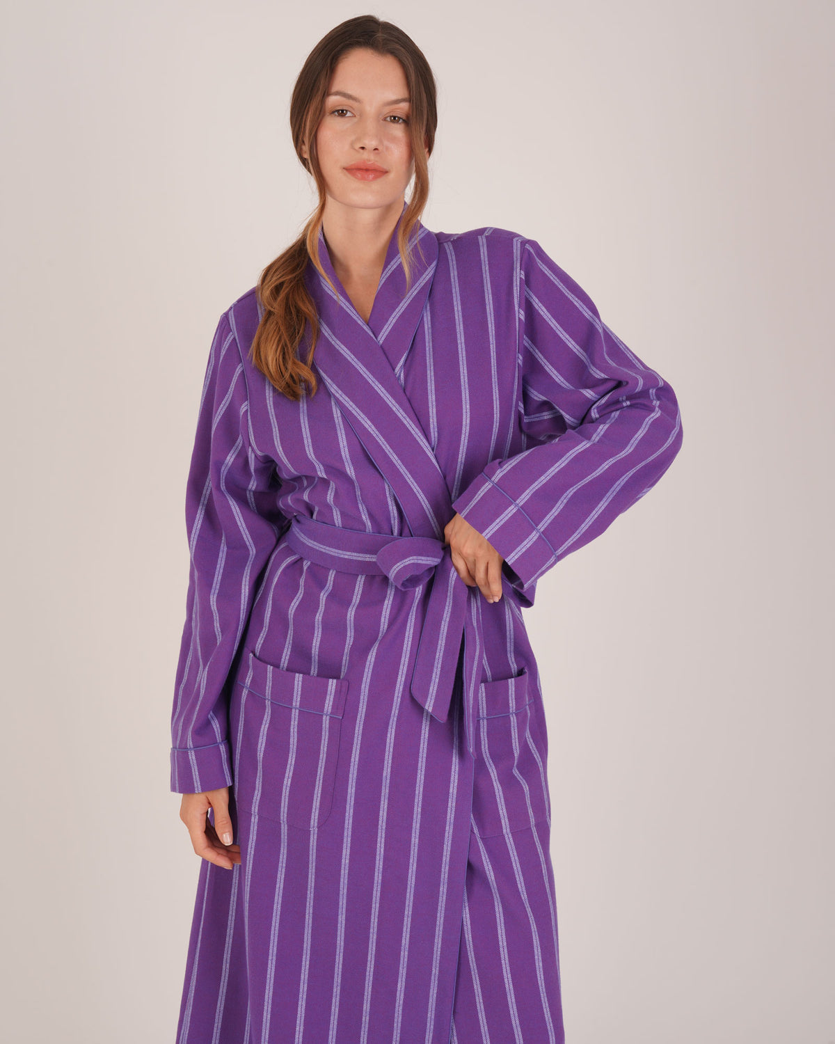 Bonsoir of London Women’s Lily Purple Stripe Brushed Cotton Dressing Gown, featuring a purple striped design, shot on a model.