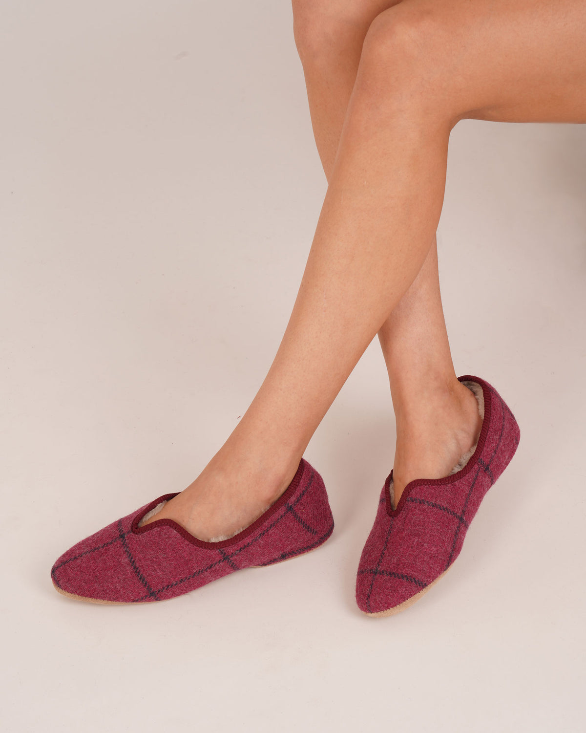Bonsoir of London Women’s Emily Sheepskin Slippers in Ava Check, crafted from luxurious Scottish silky suede with real sheepskin lining, classic scalloped front design, flexible durable suede sole, shot on a model.