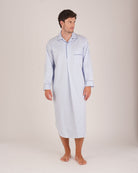 Bonsoir of London Men’s Charles Blue White Stripe Two-Fold Cotton Nightshirt, featuring a blue and white striped design, four-button placket, shirt-tail hem and generously cut fit, full body shot on a model.