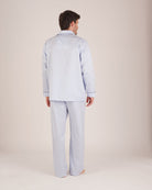 Bonsoir of London Men’s Charles Blue White Stripe, Two-Fold Cotton Pyjamas, featuring a blue and white striped design, super fine woven two-fold cotton, comfortable fit, fully elasticated waist, three jacket pockets, button fastening and concealed button fly, full body shot on a model from the back.