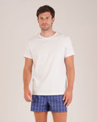 Bonsoir of London Men’s Edward Blue Plaid Classic Cotton Boxer Shorts, featuring a blue plaid check design, classic fit, three-panel seat, extra smooth seams for comfort, full body shot on model.