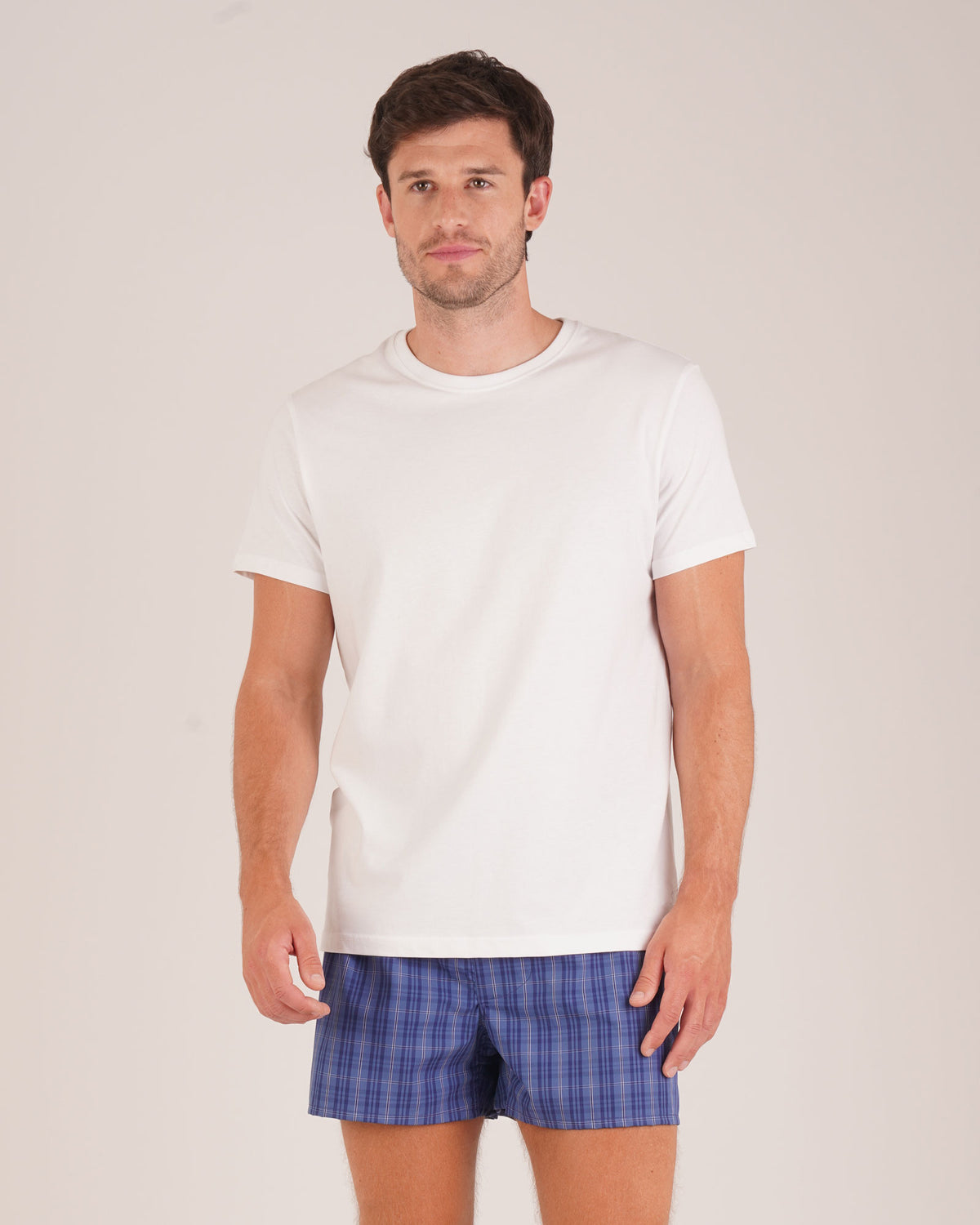 Bonsoir of London Men’s Edward Blue Plaid Classic Cotton Boxer Shorts, featuring a blue plaid check design, classic fit, three-panel seat, extra smooth seams for comfort, full body shot on model.