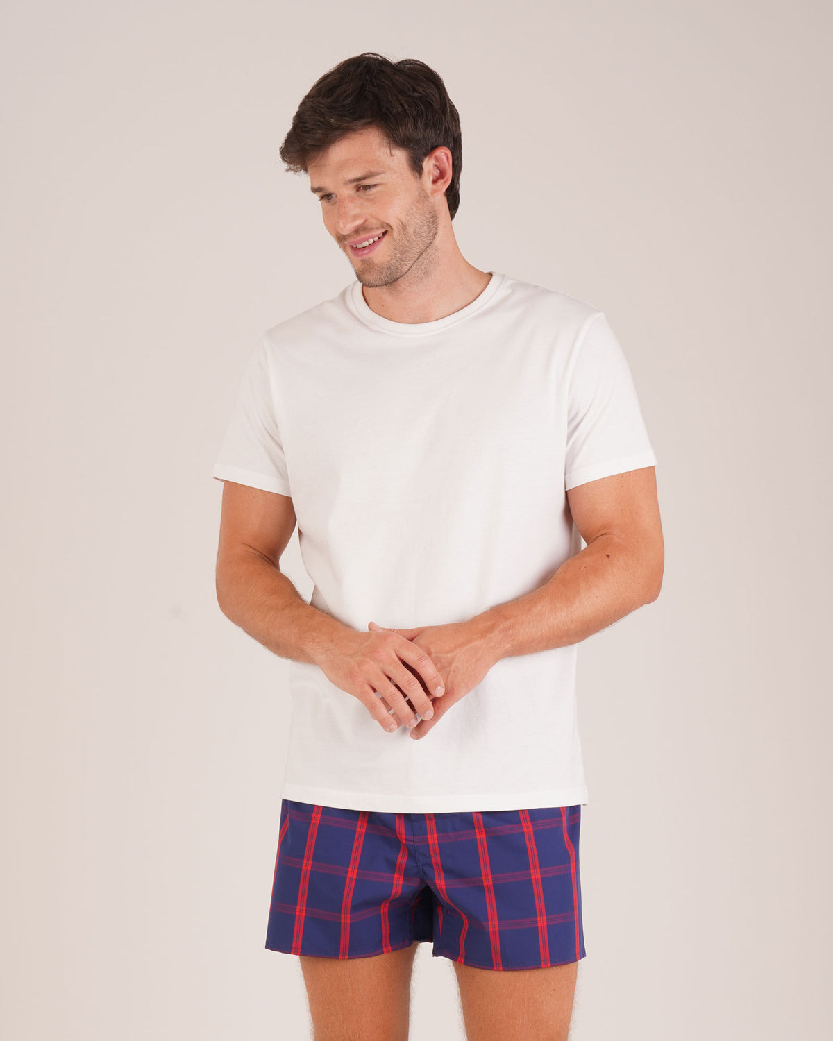 Bonsoir of London Men’s James Blue Red Tartan Classic Cotton Boxer Shorts, featuring a navy blue base with red tartan check design, classic fit, shot on model.