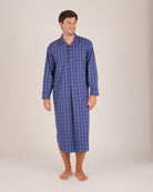 Bonsoir of London Men’s Edward Blue Plaid Classic Cotton Nightshirt, featuring a blue plaid check design, four-button placket, shirt-tail hem and generously cut fit, full body shot on a model.