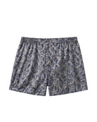 Bonsoir of London Men’s Alfie Paisley Silk Boxer Shorts, featuring a luxurious silk satin fabric, classic paisley design, fully elasticated waistband, traditional button fastening, distinctive back panel, flat-felled seams, flat lay product shot.