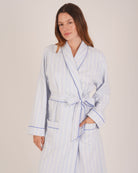 Bonsoir of London Women’s Isla Blue White Stripe Brushed Cotton Dressing Gown, featuring a blue and white striped design, shot on a model.