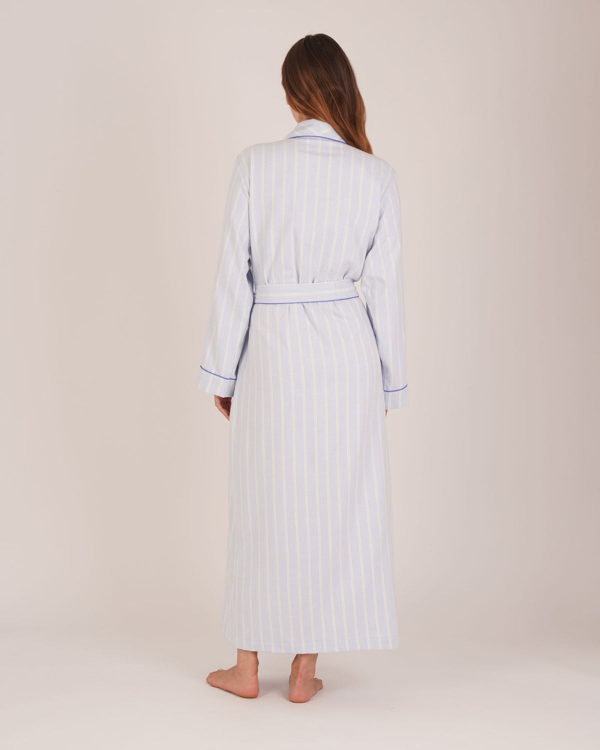 Bonsoir of London Women’s Isla Blue White Stripe Brushed Cotton Dressing Gown, featuring a blue and white striped design, shot on a model from the back.