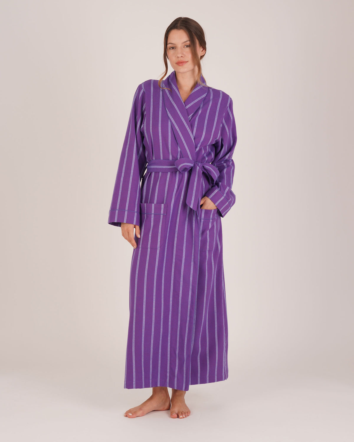 Bonsoir of London Women’s Lily Purple Stripe Brushed Cotton Dressing Gown, featuring a purple striped design, shot on a model.