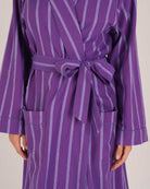 Bonsoir of London Women’s Lily Purple Stripe Brushed Cotton Dressing Gown, featuring a purple striped design, shot on a model close up.