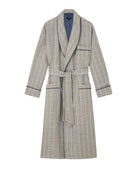 Bonsoir of London men's linen dressing gown in blue check design, silk lined, shawl collar, three pockets, turn-back cuffs, inside ties and a wide tie belt, flat shot on a studio background.