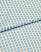 Bonsoir of London two-fold cotton fabric, featuring a blue and white striped design, close up of the fabric.
