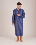 Bonsoir of London Men’s Alexander Navy White Stripe Brushed Cotton Nightshirt, featuring a navy and white striped design, four-button placket, shirt-tail hem and generously cut fit, piping detail, full body shot on a model.