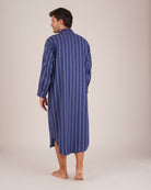 Bonsoir of London Men’s Alexander Navy White Stripe Brushed Cotton Nightshirt, featuring a navy and white striped design, four-button placket, shirt-tail hem and generously cut fit, piping detail, full body shot on a model from the back.