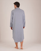Bonsoir of London Men’s Arthur Blue Check Brushed Cotton Nightshirt, featuring a blue, white and navy check design, four-button placket, shirt-tail hem and generously cut fit, full body shot on a model from the back.