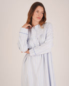 Bonsoir of London Josephine Brushed Cotton Nightdress, Isla Blue White Stripe, featuring long sleeves, button detail, a blue and white striped design, half body shot on a model.