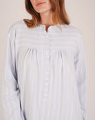 Bonsoir of London Josephine Brushed Cotton Nightdress, Isla Blue White Stripe, featuring long sleeves, button detail, a blue and white striped design, close up shot on a model.