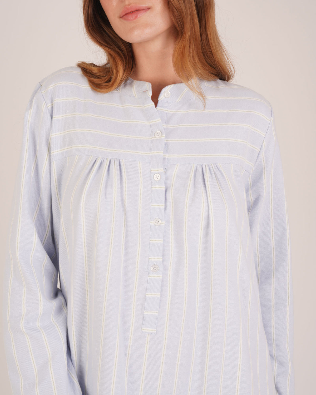 Bonsoir of London Josephine Brushed Cotton Nightdress, Isla Blue White Stripe, featuring long sleeves, button detail, a blue and white striped design, close up shot on a model.