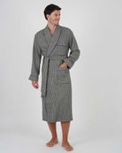 Man wearing a gray checkered robe made of wool and silk