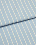 Bonsoir of London brushed cotton fabric, featuring soft pale blue and white stripes, close up of the fabric.