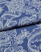 Blue fabric with white floral and leaf paisley pattern