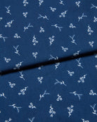 Navy blue jersey fabric with white floral pattern